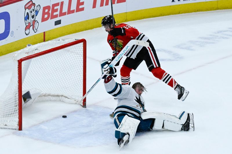 Jan 16, 2024; Chicago, Illinois, USA; Chicago Blackhawks left wing Zach Sanford (13) misses an overtime goal against San Jose Sharks goaltender Mackenzie Blackwood (29) during the third period at United Center. Mandatory Credit: Matt Marton-USA TODAY Sports