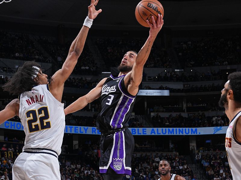 DENVER, CO - FEBRUARY 28: Chris Duarte #3 of the Sacramento Kings drives to the basket during the game against the Denver Nuggets on February 28, 2024 at the Ball Arena in Denver, Colorado. NOTE TO USER: User expressly acknowledges and agrees that, by downloading and/or using this Photograph, user is consenting to the terms and conditions of the Getty Images License Agreement. Mandatory Copyright Notice: Copyright 2024 NBAE (Photo by Garrett Ellwood/NBAE via Getty Images)