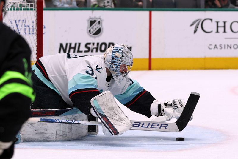 Apr 13, 2024; Dallas, Texas, USA; Seattle Kraken goaltender Philipp Grubauer (31) makes a save against the Dallas Stars in the second period at American Airlines Center. Mandatory Credit: Tim Heitman-USA TODAY Sports