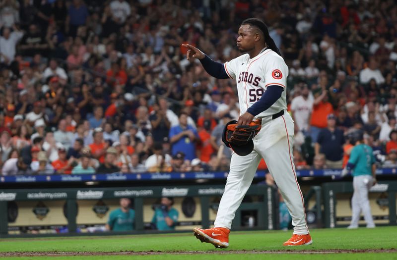 Sep 24, 2024; Houston, Texas, USA; Houston Astros starting pitcher Framber Valdez (59) points to the dugout after he was taken out in the sixth inning against the Seattle Mariners at Minute Maid Park. Mandatory Credit: Thomas Shea-Imagn Images