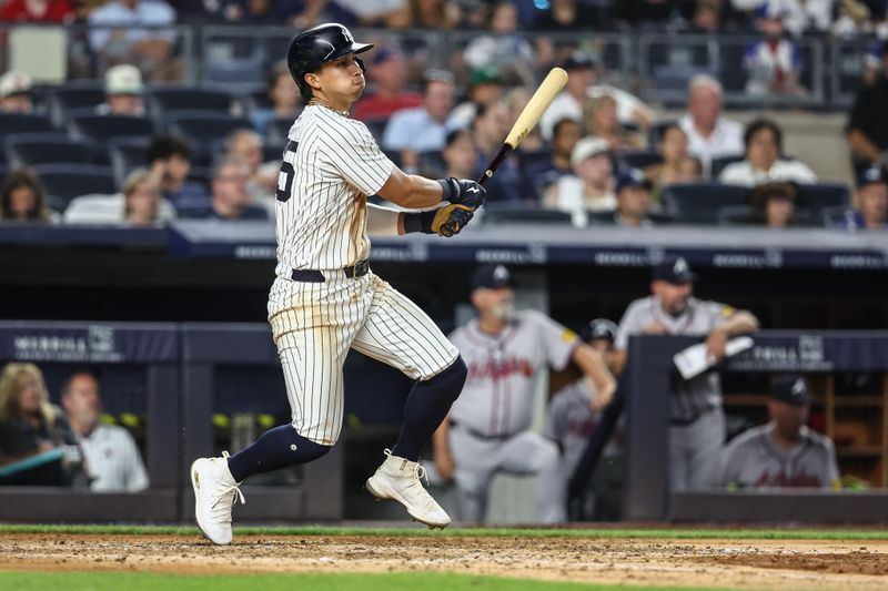 Jun 22, 2024; Bronx, New York, USA;  New York Yankees third baseman Oswaldo Cabrera (95) hits a two run single against the Atlanta Braves in the sixth inning at Yankee Stadium. Mandatory Credit: Wendell Cruz-USA TODAY Sports