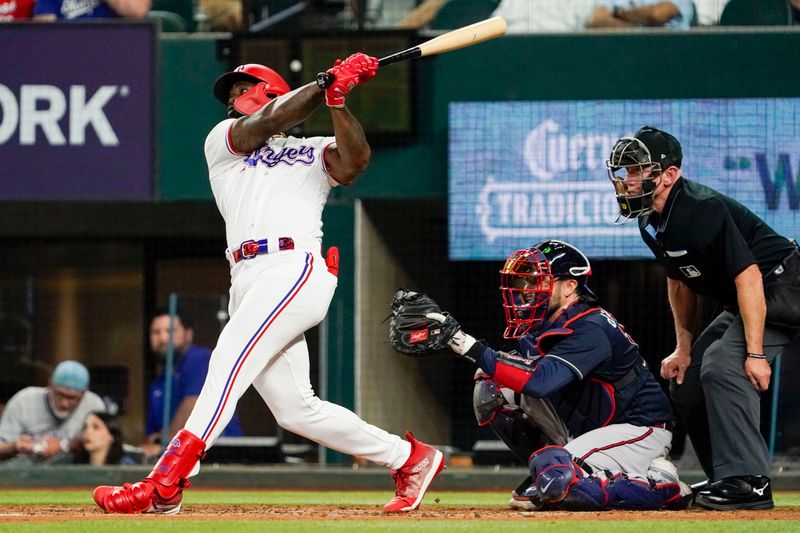 May 17, 2023; Arlington, Texas, USA; Texas Rangers right fielder Adolis Garcia (53) follows thru on a solo home run during the fourth inning against the Atlanta Braves at Globe Life Field. Mandatory Credit: Raymond Carlin III-USA TODAY Sports
