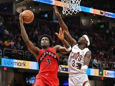 CLEVELAND, OHIO - NOVEMBER 26: O.G. Anunoby #3 of the Toronto Raptors shoots over Caris LeVert #3 of the Cleveland Cavaliers during the fourth quarter at Rocket Mortgage Fieldhouse on November 26, 2023 in Cleveland, Ohio. The Cavaliers defeated the Raptors 105-102. NOTE TO USER: User expressly acknowledges and agrees that, by downloading and or using this photograph, User is consenting to the terms and conditions of the Getty Images License Agreement. (Photo by Jason Miller/Getty Images)