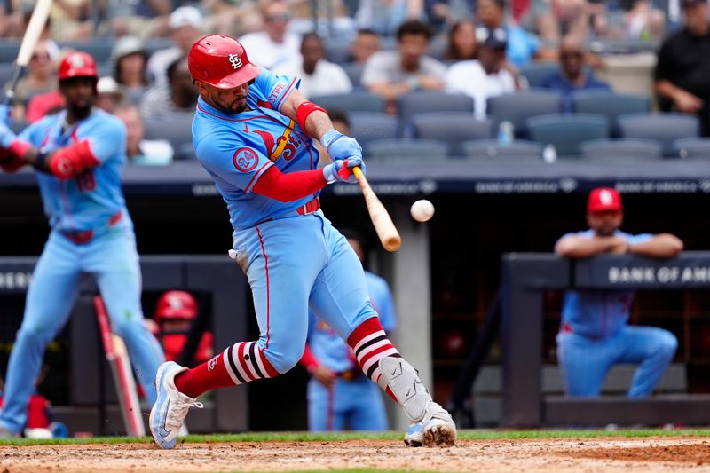 Aug 31, 2024; Bronx, New York, USA; St. Louis Cardinals catcher Ivan Herrera (48) hits an RBI double against the New York Yankees during the sixth inning at Yankee Stadium. Mandatory Credit: Gregory Fisher-USA TODAY Sports