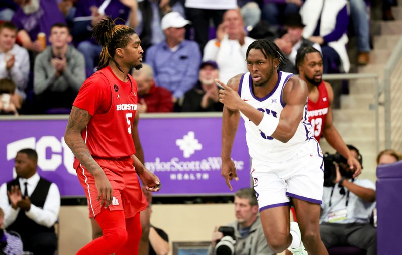 Jan 13, 2024; Fort Worth, Texas, USA;  TCU Horned Frogs center Ernest Udeh Jr. (8) reacts in front of Houston Cougars forward Ja'Vier Francis (5) after scoring during the second half at Ed and Rae Schollmaier Arena. Mandatory Credit: Kevin Jairaj-USA TODAY Sports