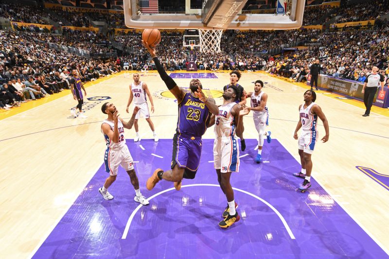 LOS ANGELES, CA - MARCH 22: LeBron James #23 of the Los Angeles Lakers drives to the basket during the game against the Philadelphia 76ers on March 22, 2024 at Crypto.Com Arena in Los Angeles, California. NOTE TO USER: User expressly acknowledges and agrees that, by downloading and/or using this Photograph, user is consenting to the terms and conditions of the Getty Images License Agreement. Mandatory Copyright Notice: Copyright 2024 NBAE (Photo by Adam Pantozzi/NBAE via Getty Images)