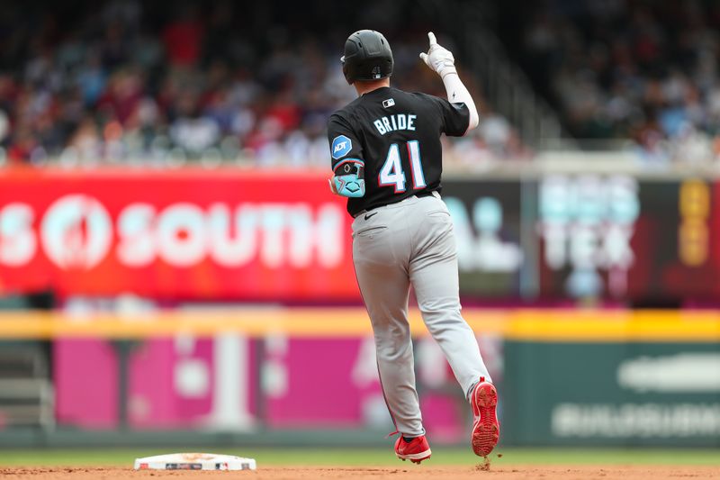 Aug 4, 2024; Cumberland, Georgia, USA; Miami Marlins third baseman Jonah Bride (41) celebrates scoring a home run in a game against the Atlanta Braves in the forth inning at Truist Park. Mandatory Credit: Mady Mertens-USA TODAY Sports