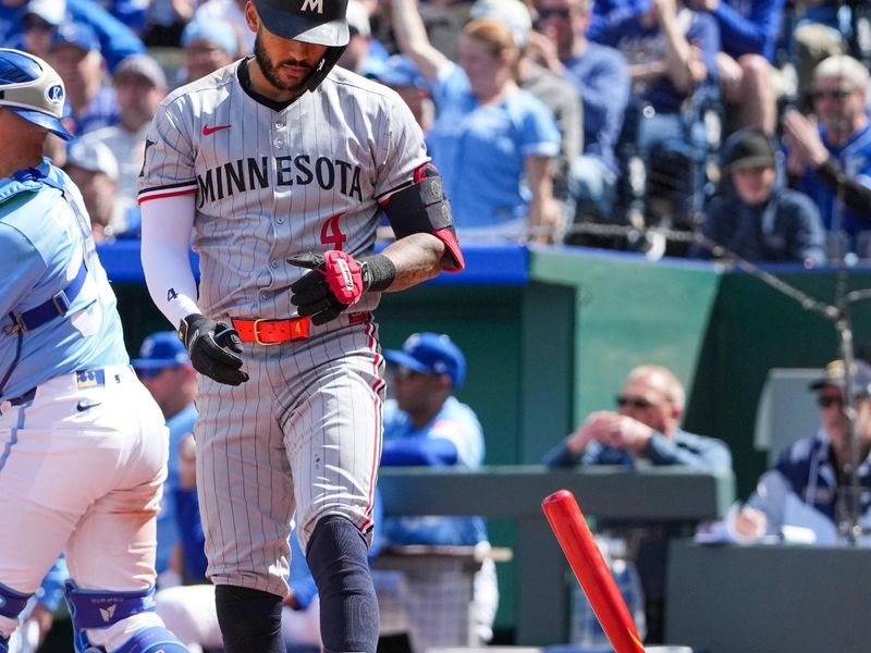 Apr 10, 2025; Kansas City, Missouri, USA; Minnesota Twins shortstop Carlos Correa (4) reacts after striking out against the Kansas City Royals in the sixth inning  at Kauffman Stadium. Mandatory Credit: Denny Medley-Imagn Images