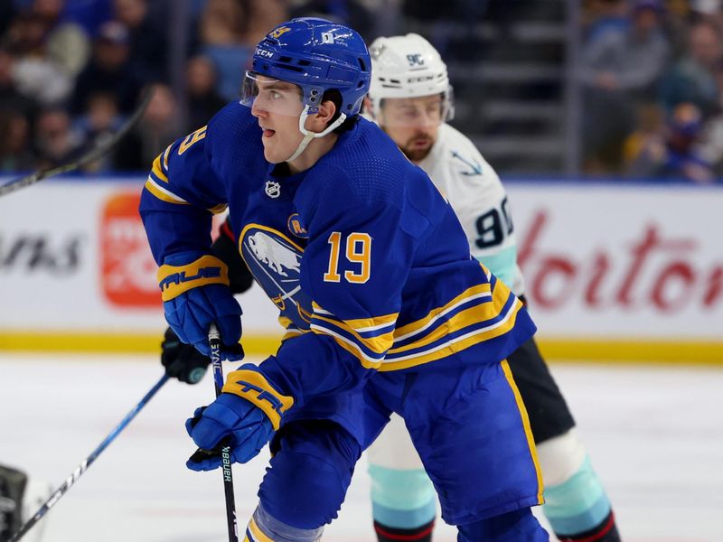 Jan 9, 2024; Buffalo, New York, USA;  Buffalo Sabres center Peyton Krebs (19) skates up ice with the puck during the second period against the Seattle Kraken at KeyBank Center. Mandatory Credit: Timothy T. Ludwig-USA TODAY Sports