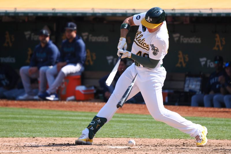 Sep 20, 2023; Oakland, California, USA; Oakland Athletics first baseman Ryan Noda (49) breaks his bat during the eighth inning against the Seattle Mariners at Oakland-Alameda County Coliseum. Mandatory Credit: Kelley L Cox-USA TODAY Sports