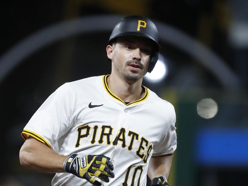 Apr 8, 2024; Pittsburgh, Pennsylvania, USA;  Pittsburgh Pirates left fielder Bryan Reynolds (10) circles the bases on a solo home run against the Detroit Tigers during the sixth inning at PNC Park. Mandatory Credit: Charles LeClaire-USA TODAY Sports