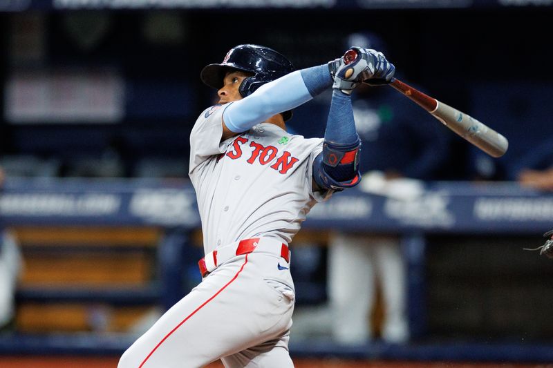 May 22, 2024; St. Petersburg, Florida, USA;  Boston Red Sox outfielder Ceddanne Rafaela (43) hits an rbi single against the Tampa Bay Rays in the fifth inning at Tropicana Field. Mandatory Credit: Nathan Ray Seebeck-USA TODAY Sports