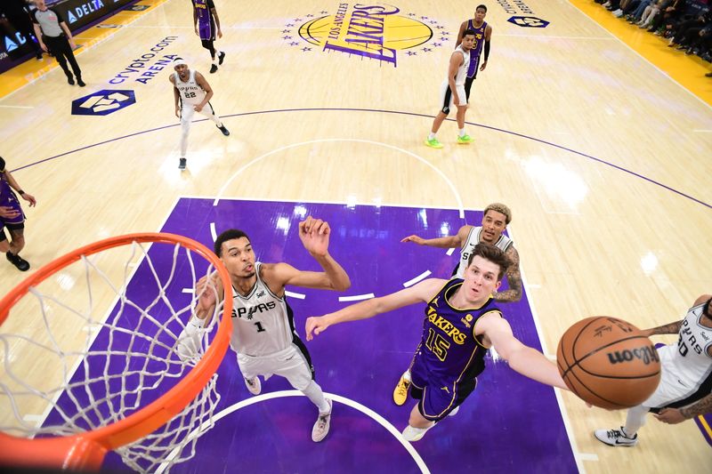 LOS ANGELES, CA - FEBRUARY 23:  Austin Reaves #15 of the Los Angeles Lakers goes to the basket during the game on February 23, 2024 at Crypto.Com Arena in Los Angeles, California. NOTE TO USER: User expressly acknowledges and agrees that, by downloading and/or using this Photograph, user is consenting to the terms and conditions of the Getty Images License Agreement. Mandatory Copyright Notice: Copyright 2024 NBAE (Photo by Adam Pantozzi/NBAE via Getty Images)