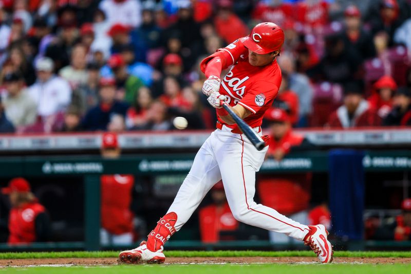 May 3, 2025; Cincinnati, Ohio, USA; Cincinnati Reds outfielder Tyler Callihan (32) hits a RBI single in the second inning against the Washington Nationals at Great American Ball Park. Mandatory Credit: Katie Stratman-Imagn Images