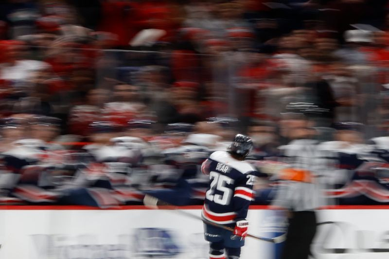 Jan 16, 2024; Washington, District of Columbia, USA; Washington Capitals defenseman Ethan Bear (25) celebrates with teammates after scoring a goal against the Anaheim Ducks in the first period at Capital One Arena. Mandatory Credit: Geoff Burke-USA TODAY Sports