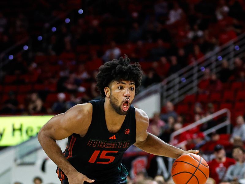 Jan 30, 2024; Raleigh, North Carolina, USA; Miami (Fl) Hurricanes forward Norchad Omier (15) dribbles with the ball during the second half against North Carolina State Wolfpack at PNC Arena. Mandatory Credit: Jaylynn Nash-USA TODAY Sports