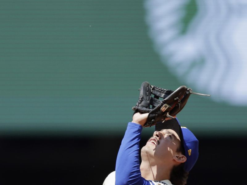 Jun 1, 2025; Seattle, Washington, USA; Seattle Mariners second baseman Cole Young (2) catches Minnesota Twins shortstop Carlos Correa (not pictured) pop fly during the sixth inning at T-Mobile Park. Mandatory Credit: John Froschauer-Imagn Images