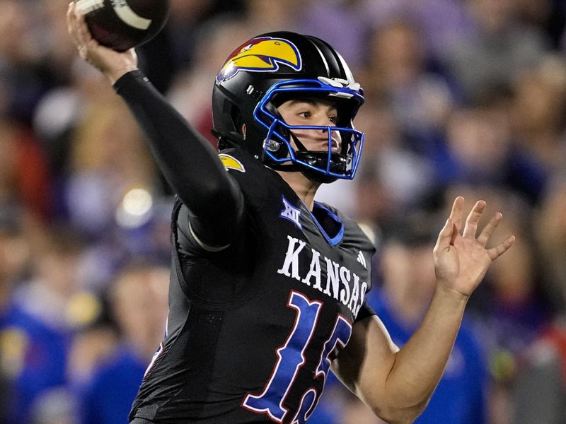 Nov 18, 2023; Lawrence, Kansas, USA; Kansas Jayhawks quarterback Cole Ballard (15) throws a pass during the first half against the Kansas State Wildcats at David Booth Kansas Memorial Stadium. Mandatory Credit: Jay Biggerstaff-USA TODAY Sports