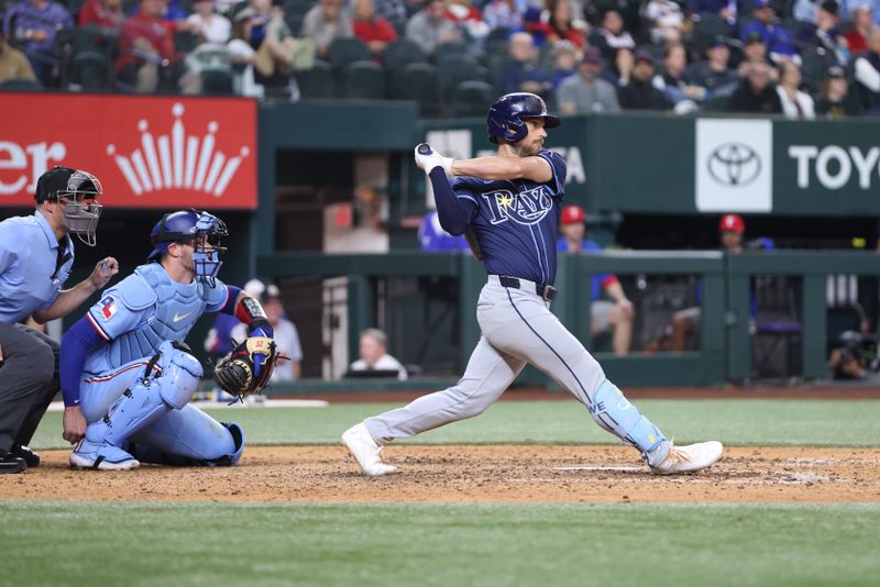 Apr 6, 2025; Arlington, Texas, USA; Tampa Bay Rays second base Brandon Lowe (8) drives in a run in the eighth inning against the Texas Rangers at Globe Life Field. Mandatory Credit: Tim Heitman-Imagn Images