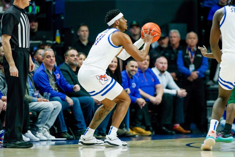 Jan 9, 2024; Boise, Idaho, USA; Boise State Broncos guard Chibuzo Agbo (11) attempts to shoot a basket during the first half against the Colorado State Rams at ExtraMile Arena. Mandatory Credit: Brian Losness-USA TODAY Sports