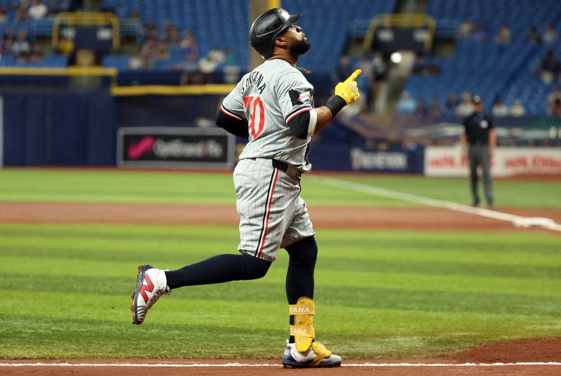 Sep 3, 2024; St. Petersburg, Florida, USA;  Minnesota Twins first base Carlos Santana (30) runs around the bases after hitting a home run against the Tampa Bay Rays during the second inning at Tropicana Field. Mandatory Credit: Kim Klement Neitzel-Imagn Images