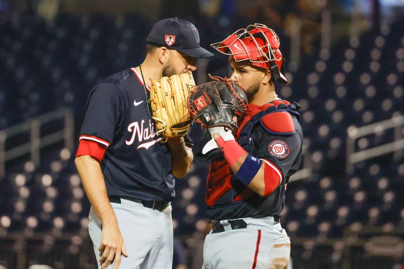 Mar 18, 2024; West Palm Beach, Florida, USA;  Washington Nationals pitcher Matt Barnes talks with his catcher Washington Nationals catcher Keibert Ruiz, right, during the seventh inning against the Houston Astros at The Ballpark of the Palm Beaches. Mandatory Credit: Reinhold Matay-USA TODAY Sports