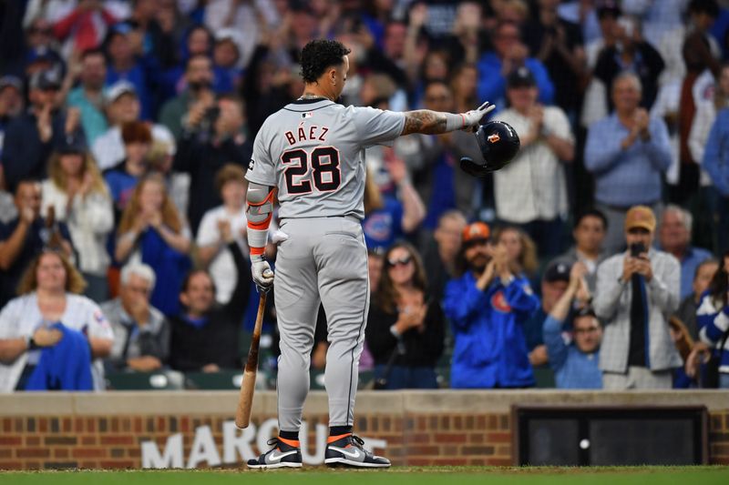 Aug 20, 2024; Chicago, Illinois, USA; Detroit Tigers shortstop Javier Baez (28) reacts and waves to the Chicago Cubs dugout during his standing ovation for his first game back at Wrigley Field during the second inning in a game. Mandatory Credit: Patrick Gorski-USA TODAY Sports