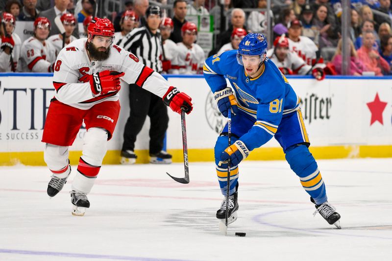 Oct 19, 2024; St. Louis, Missouri, USA;  St. Louis Blues center Dylan Holloway (81) controls the puck against the Carolina Hurricanes during the second period at Enterprise Center. Mandatory Credit: Jeff Curry-Imagn Images