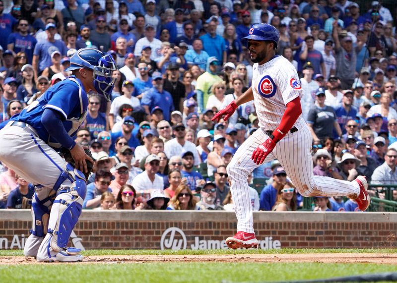 Aug 19, 2023; Chicago, Illinois, USA; Chicago Cubs third baseman Jeimer Candelario (9) is safe at home plate as Kansas City Royals catcher Freddy Fermin (34) waits for a late throw during the second inning at Wrigley Field. Mandatory Credit: David Banks-USA TODAY Sports