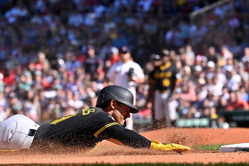 Aug 31, 2025; Boston, Massachusetts, USA; Pittsburgh Pirates second baseman Nick Gonzales (39) slides into third base against the Boston Red Sox during the eighth inning at Fenway Park. Mandatory Credit: Eric Canha-Imagn Images