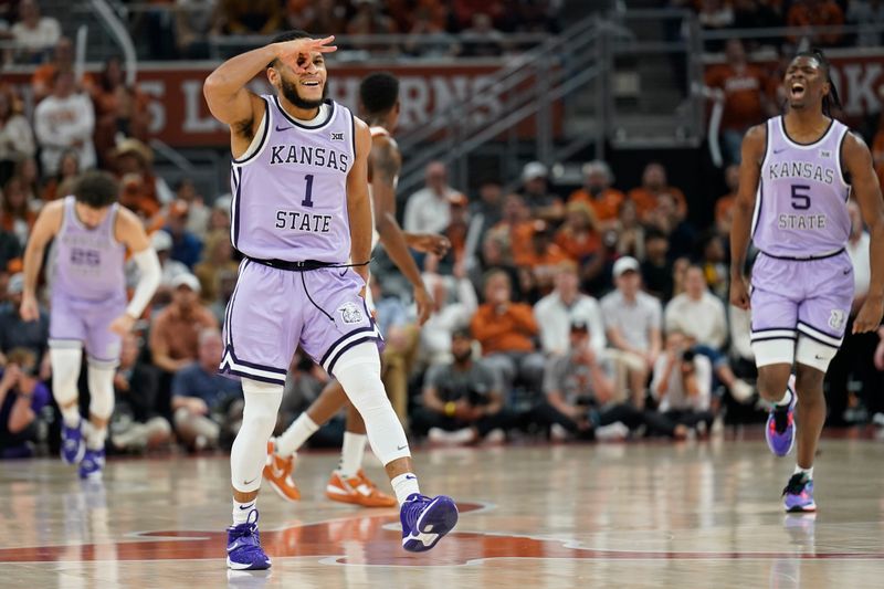 Jan 3, 2023; Austin, Texas, USA; Kansas State Wildcats guards Markquis Nowell (1) and Cam Carter (5) react after Nowell scored during the first half against the Texas Longhorns at Moody Center. Mandatory Credit: Scott Wachter-USA TODAY Sports