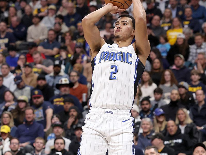 DENVER, COLORADO - JANUARY 05: Caleb Houstan #2 of the Orlando Magic puts up a shot against  the Denver Nuggets in the first quarter at Ball Arena on January 05, 2024 in Denver, Colorado.  NOTE TO USER: User expressly acknowledges and agrees that, by downloading and or using this photograph, User is consenting to the terms and conditions of the Getty Images License Agreement.  (Photo by Matthew Stockman/Getty Images)