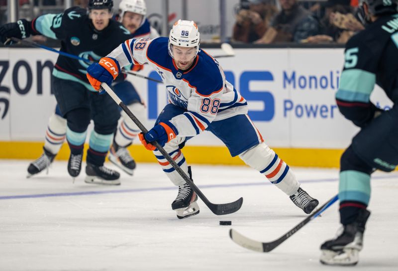 Oct 25, 2025; Seattle, Washington, USA; Edmonton Oilers forward Andrew Mangiapane (88) skates with the puck during the first period against the Seattle Kraken at Climate Pledge Arena. Mandatory Credit: Stephen Brashear-Imagn Images