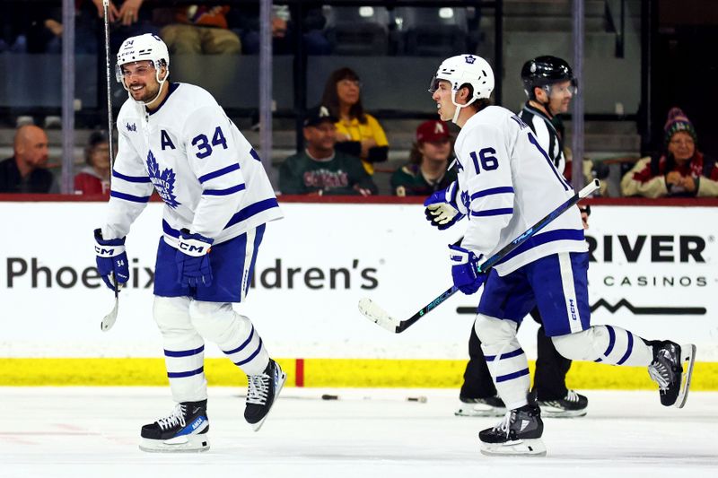 Feb 21, 2024; Tempe, Arizona, USA; Toronto Maple Leafs center Auston Matthews (34) celebrates after scoring a goal during the second period against the Arizona Coyotes at Mullett Arena. Mandatory Credit: Mark J. Rebilas-USA TODAY Sports