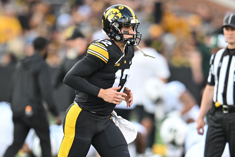 Sep 30, 2023; Iowa City, Iowa, USA; Iowa Hawkeyes quarterback Cade McNamara (12) warms up before the game against the Michigan State Spartans at Kinnick Stadium. Mandatory Credit: Jeffrey Becker-USA TODAY Sports