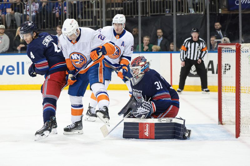 Mar 17, 2024; New York, New York, USA; New York Rangers goaltender Igor Shesterkin (31) makes a as New York Islanders center Kyle Palmieri (21) battles defenseman Braden Schneider (4) during the first period at Madison Square Garden. Mandatory Credit: Vincent Carchietta-USA TODAY Sports