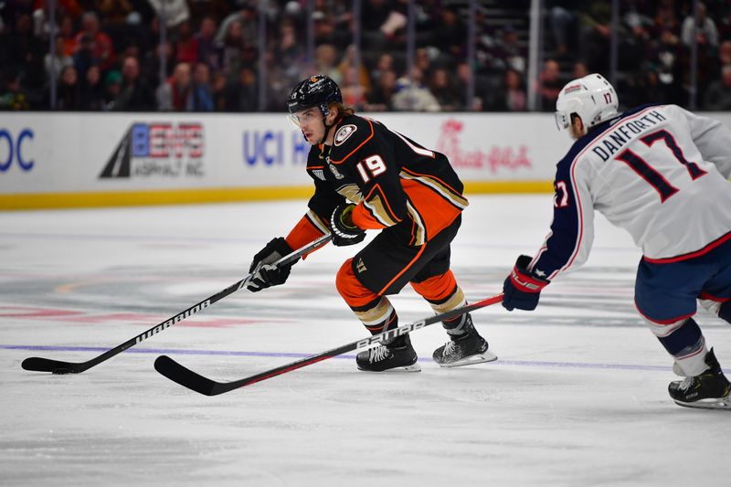 Feb 21, 2024; Anaheim, California, USA; Anaheim Ducks right wing Troy Terry (19) moves the puck against the Columbus Blue Jackets during the third period at Honda Center. Mandatory Credit: Gary A. Vasquez-USA TODAY Sports