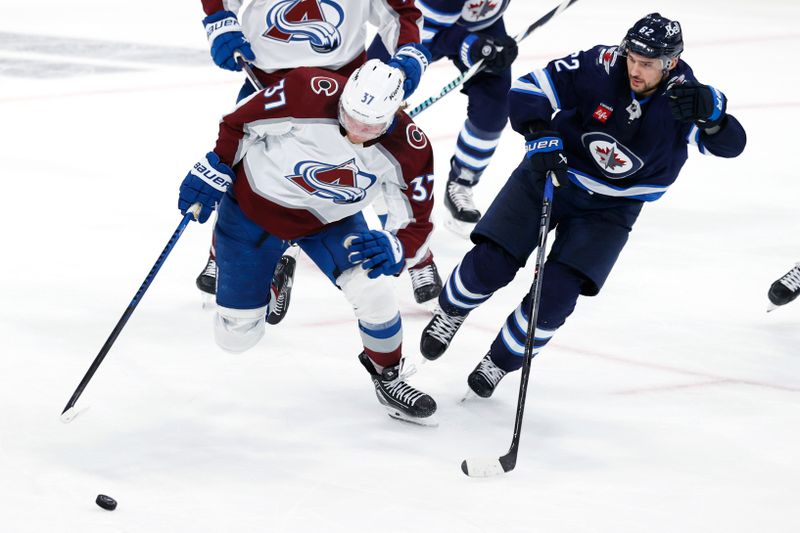 Apr 30, 2024; Winnipeg, Manitoba, CAN; Colorado Avalanche center Casey Mittelstadt (37) is chased down by Winnipeg Jets right wing Nino Niederreiter (62) in the third period in game five of the first round of the 2024 Stanley Cup Playoffs at Canada Life Centre. Mandatory Credit: James Carey Lauder-USA TODAY Sports