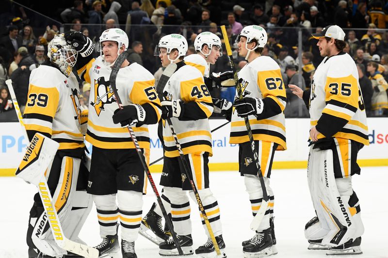 Jan 4, 2024; Boston, Massachusetts, USA; The Pittsburgh Penguins celebrate after defeating the Boston Bruins at TD Garden. Mandatory Credit: Bob DeChiara-USA TODAY Sports