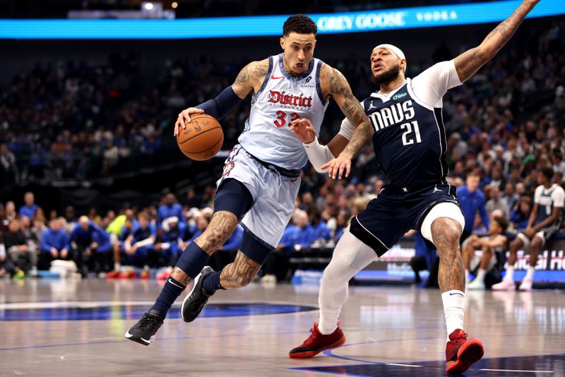 DALLAS, TEXAS - JANUARY 27: Kyle Kuzma #33 of the Washington Wizards drives to the basket against Daniel Gafford #21 of the Dallas Mavericks during the second quarter at American Airlines Center on January 27, 2025 in Dallas, Texas. NOTE TO USER: User expressly acknowledges and agrees that, by downloading and or using this photograph, User is consenting to the terms and conditions of the Getty Images License Agreement. (Photo by Tim Heitman/Getty Images)