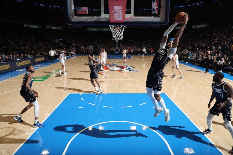 OKLAHOMA CITY, OK - MARCH 14: Daniel Gafford #21 of the Dallas Mavericks grabs a rebound during the game against the Oklahoma City Thunder on March 13, 2024 at Paycom Arena in Oklahoma City, Oklahoma. NOTE TO USER: User expressly acknowledges and agrees that, by downloading and or using this photograph, User is consenting to the terms and conditions of the Getty Images License Agreement. Mandatory Copyright Notice: Copyright 2024 NBAE (Photo by Zach Beeker/NBAE via Getty Images)