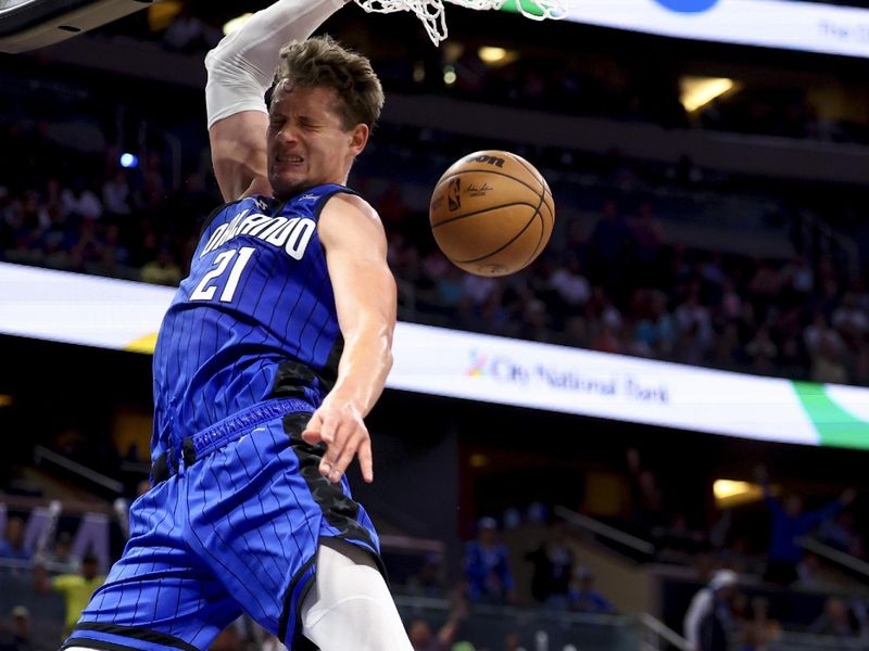 ORLANDO, FLORIDA - MARCH 23: Moritz Wagner #21 of the Orlando Magic slams the ball against the New York Knicks during the fourth quarter at Amway Center on March 23, 2023 in Orlando, Florida. NOTE TO USER: User expressly acknowledges and agrees that, by downloading and or using this photograph, User is consenting to the terms and conditions of the Getty Images License Agreement. (Photo by Douglas P. DeFelice/Getty Images)