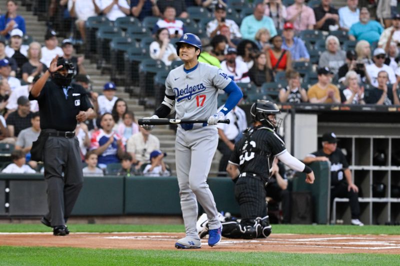 Jun 24, 2024; Chicago, Illinois, USA;  Los Angeles Dodgers two-way player Shohei Ohtani (17) reacts after he strikes out during the first inning against the Chicago White Sox at Guaranteed Rate Field. Mandatory Credit: Matt Marton-USA TODAY Sports