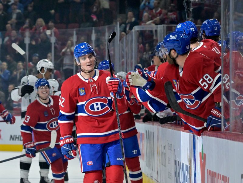 Oct 17, 2024; Montreal, Quebec, CAN; Montreal Canadiens defenseman Justin Barron (52) celebrates with teammates after scoring a goal against the Los Angeles Kings during the first period at the Bell Centre. Mandatory Credit: Eric Bolte-Imagn Images