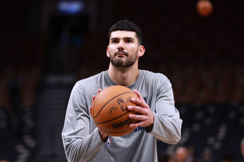 TORONTO, CANADA - APRIL 7: Tristan Vukcevic #00 of the Washington Wizards warms up before the game against the Toronto Raptors on April 7, 2024 at the Scotiabank Arena in Toronto, Ontario, Canada.  NOTE TO USER: User expressly acknowledges and agrees that, by downloading and or using this Photograph, user is consenting to the terms and conditions of the Getty Images License Agreement.  Mandatory Copyright Notice: Copyright 2024 NBAE (Photo by Vaughn Ridley/NBAE via Getty Images)