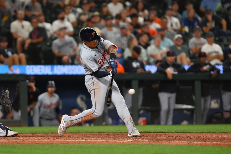 Aug 7, 2024; Seattle, Washington, USA; Detroit Tigers third baseman Gio Urshela (13) hits a 2-RBI single against the Seattle Mariners during the ninth inning at T-Mobile Park. Mandatory Credit: Steven Bisig-USA TODAY Sports