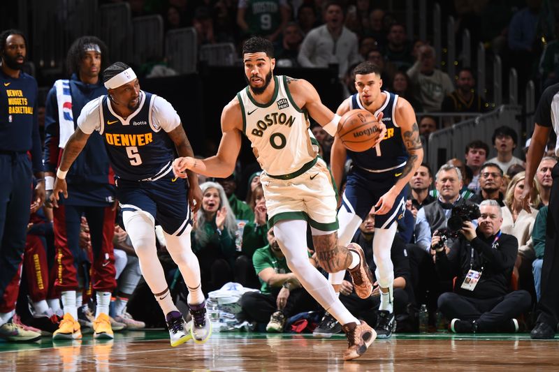 BOSTON, MA - JANUARY 19:  Jayson Tatum #0 of the Boston Celtics handles the ball during the game against the Denver Nuggets on January 19, 2024 at the TD Garden in Boston, Massachusetts. NOTE TO USER: User expressly acknowledges and agrees that, by downloading and or using this photograph, User is consenting to the terms and conditions of the Getty Images License Agreement. Mandatory Copyright Notice: Copyright 2024 NBAE  (Photo by Brian Babineau/NBAE via Getty Images)