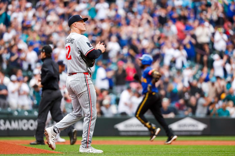 May 30, 2025; Seattle, Washington, USA; Minnesota Twins starting pitcher Zebby Matthews (52) walks around the mound after surrendering the second of back-to-back home runs against the Seattle Mariners during the first inning at T-Mobile Park. Mandatory Credit: Joe Nicholson-Imagn Images