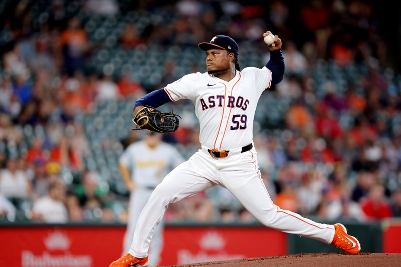 Jul 31, 2024; Houston, Texas, USA; Houston Astros starting pitcher Framber Valdez (59) pitches against the Pittsburgh Pirates during the first inning at Minute Maid Park. Mandatory Credit: Erik Williams-USA TODAY Sports