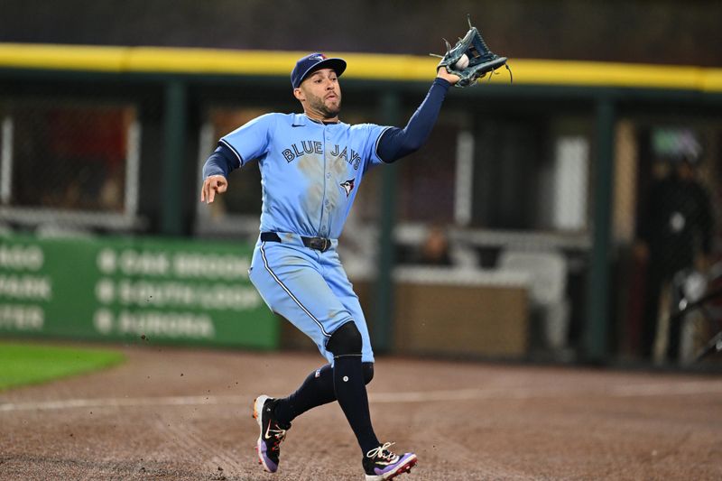 May 28, 2024; Chicago, Illinois, USA;  Toronto Blue Jays outfielder George Springer (4) catches a foul ball in the fifth inning against the Chicago White Sox at Guaranteed Rate Field. Mandatory Credit: Jamie Sabau-USA TODAY Sports
